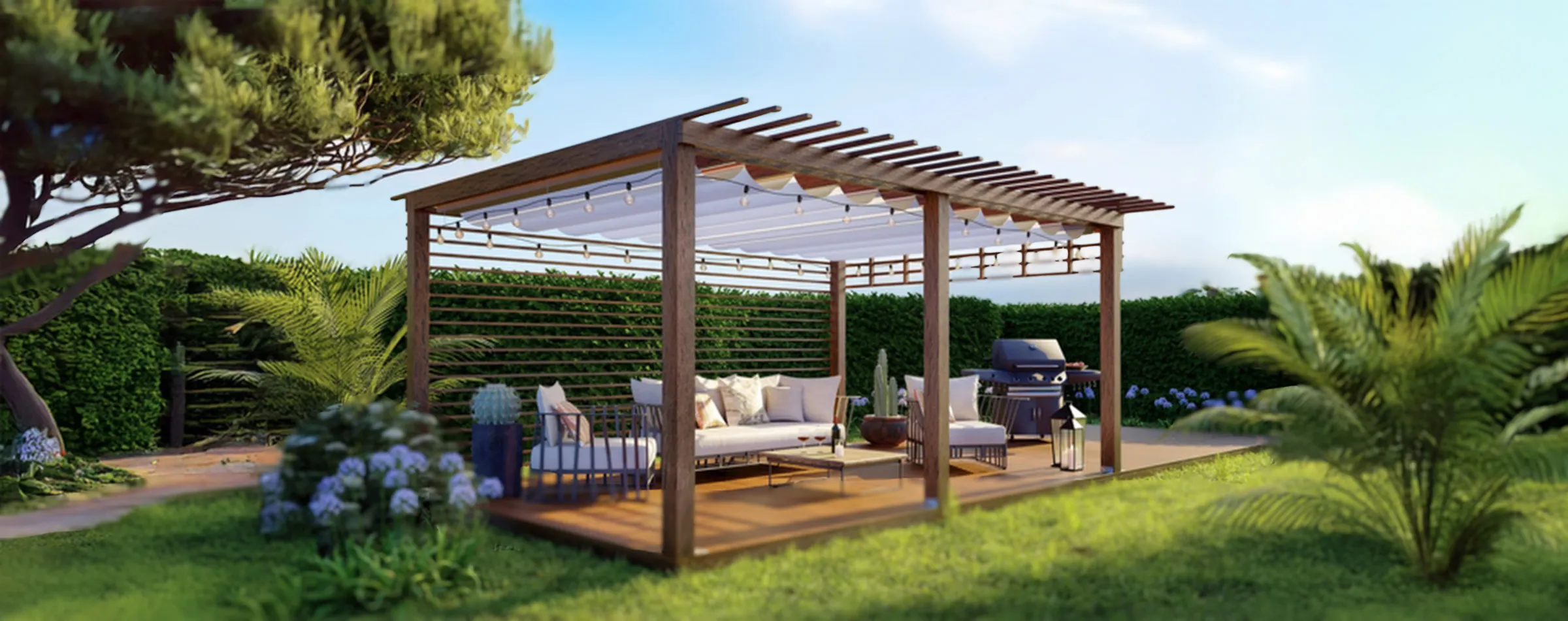 A wooden pergola with a white canopy sits in a lush garden like a chic cabana in Torontos finest retreats. Underneath, cozy seating with cushions invites relaxation. The greenery flourishes with hedges, palm plants, and flowers. Nearby, a barbecue grill beckons under the clear blue sky.