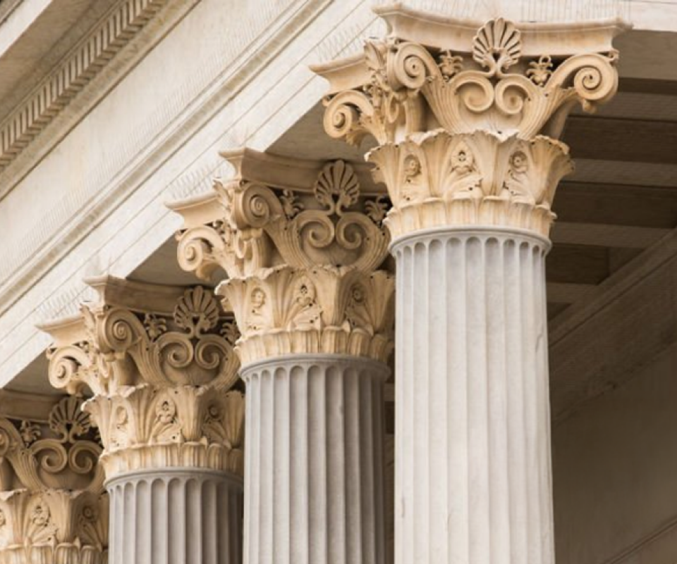 Classical columns symbolising professional standards