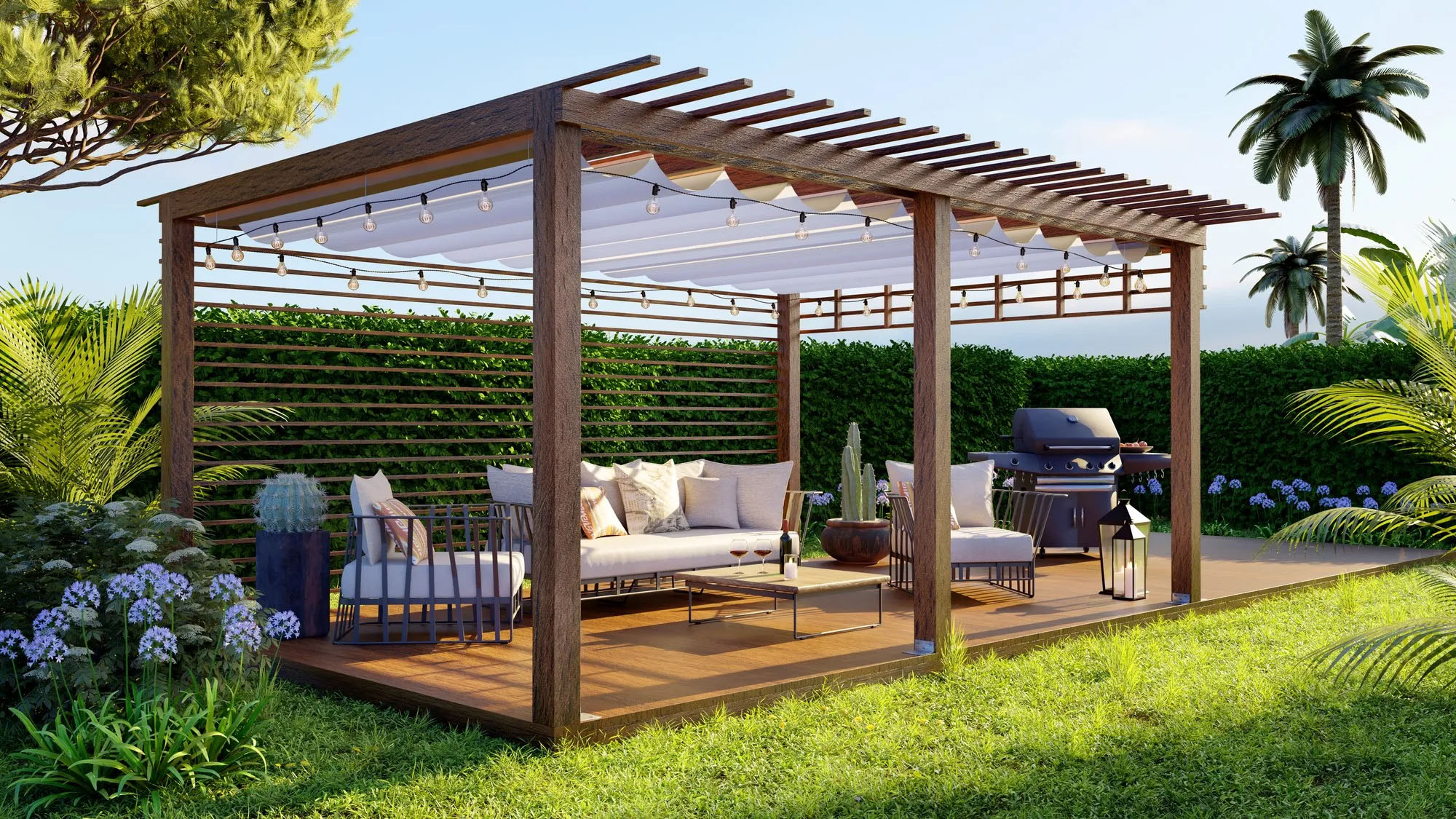 A wooden pergola in a lush garden features a seating area with cushions and a coffee table. String lights hang overhead. A barbecue grill stands nearby, surrounded by green plants and colorful flowers. The scene is bathed in sunlight.